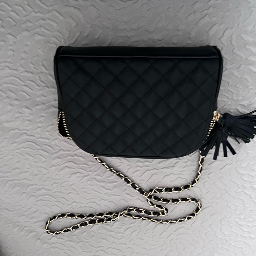 Sleek black with gold chain